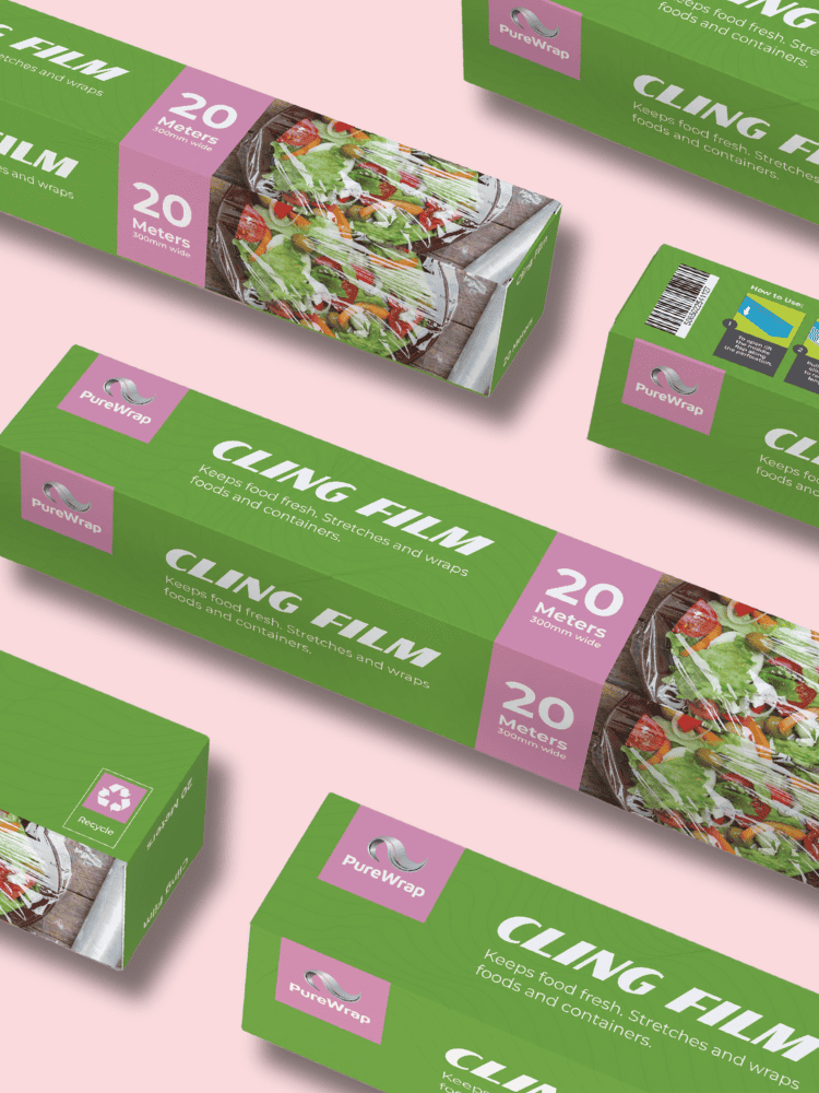 Boxes of PureWrap cling film arranged diagonally on a light pink background, showing 20 meters and a salad image on the packaging.