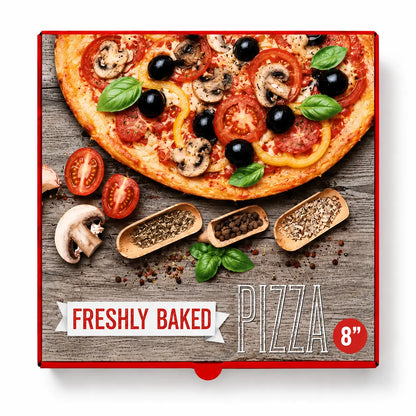 A pizza topped with tomatoes, olives, mushrooms, and basil is pictured on a box labeled “8 Inch Pizza Boxes Red 90 Pack,” surrounded by spices and vegetables on a wooden background.