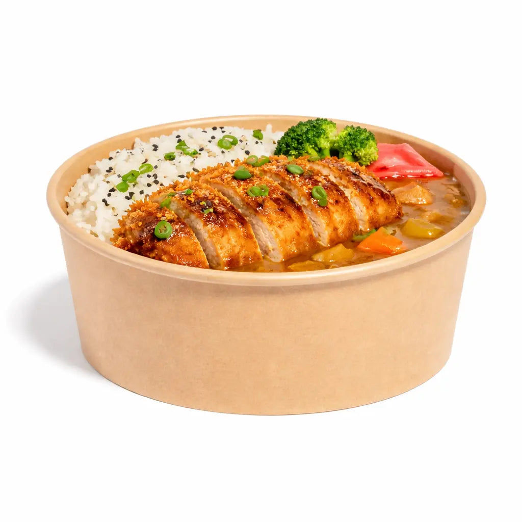 The Kraft Paper Bowl 1300ml 300 Pack is ideal for takeaway meals like sliced breaded chicken cutlet over curry with rice, herbs, broccoli, and pickled vegetables, offering a convenient and reliable food packaging solution.
