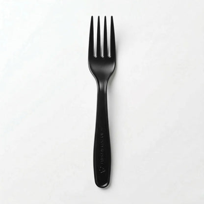 A single fork from the Black Plastic Forks 1000 Pack, commonly used as disposable cutlery for takeaway meals, stands upright on a plain white surface.