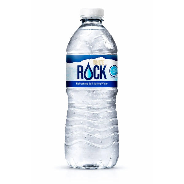 A 500ml bottle of White Rock Water from the 24-pack, featuring a blue and white label, stands upright against a white background—perfect for wholesale bottled water needs.