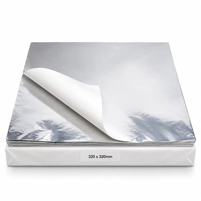 A stack of Foil-Lined Paper Wrap Sheets 12 x 12 Inch, perfect as a grease barrier for sandwich or burger wrap, with one sheet partially peeled back.